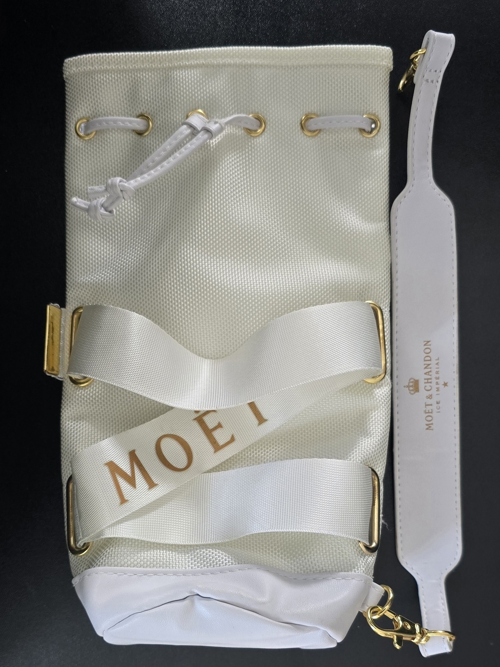 Moët & Chandon branded insulated champagne ice bag with drawstring closure.
F